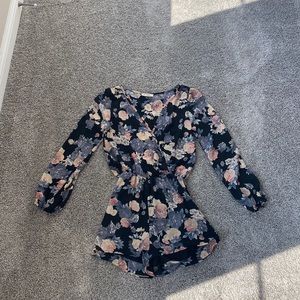 Navy blue and floral women’s romper.